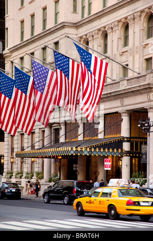 American flags fly over Plaza Hotel entrance in New York City USA Stock Photo