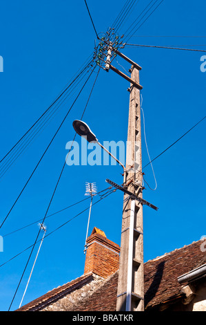 Precast concrete telephone post and wires - France. Stock Photo