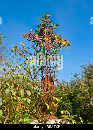 Roadside decorative cast iron cross - France. Stock Photo