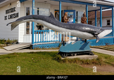 A wooden sculpture of a blue whale in Tadoussac in Quebec