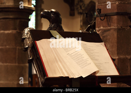 Prestbury church st Pitter’s Christian religious candle morning prayer book preparation stained glass heritage catholic religiou Stock Photo