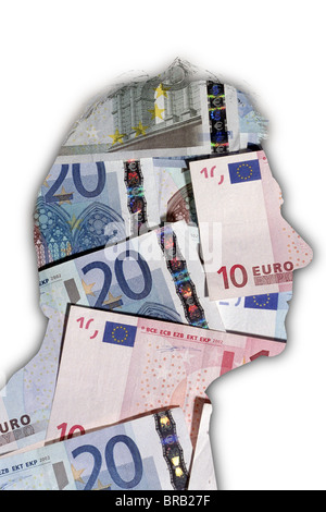 Outline of a mans head filled with Euro bank notes. Stock Photo