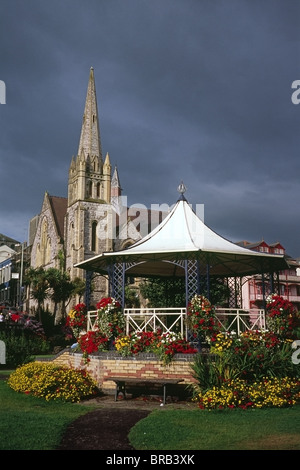 Bandstand in Jubilee Gardens with Emmanuel Church in the background, Ilfracombe, Devon, England, UK Stock Photo