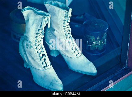 Landis Valley  museum, historical collection of early American farm life style, equipment, crafts Female shoes old fashion store Stock Photo