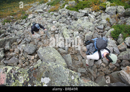 Hikers ascending King Ravine Trail. Located in King Ravine in the White Mountains, New Hampshire USA Stock Photo