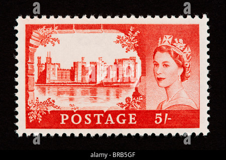 Postage stamp from Great Britain depicting Caernarvon Castle in Wales and Queen Elizabeth II. Stock Photo