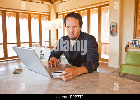 man working on laptop at home Stock Photo
