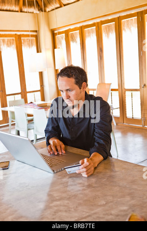 man working on laptop at home Stock Photo