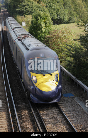 The new High speed train rushing through the Kent countryside Stock Photo