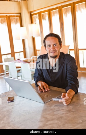 man working on laptop at home Stock Photo