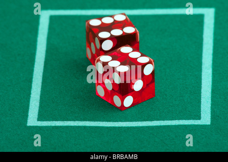 Pair of dice on green casino table felt, 12 rolled Stock Photo