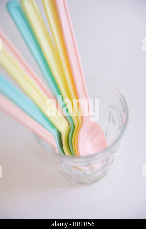 Colorful spoons in a glass