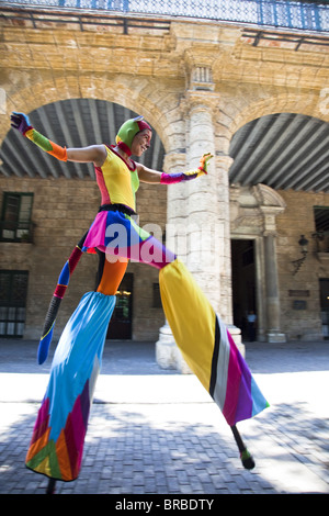 Performer in the street in Old Havana walking on stilts, Havana, Cuba, West Indies, Central America Stock Photo