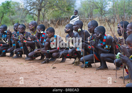 Young warriors of the Hamer tribe waiting for the Jumping of the Bull ceremony, Omo valley, Ethiopia Stock Photo