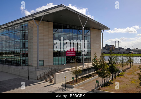 Modern administration offices for Newham council workers beside DLR train station with Royal Docks & London City Airport beyond England UK Stock Photo