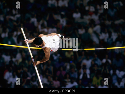 Male Pole Vaulter hits bar at meeting Stock Photo