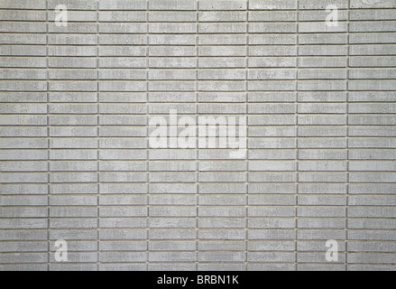 Large wall of white painted bricks taken from distance Stock Photo