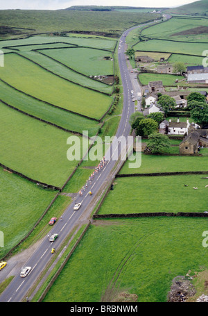 Cycling peleton races along country road Stock Photo