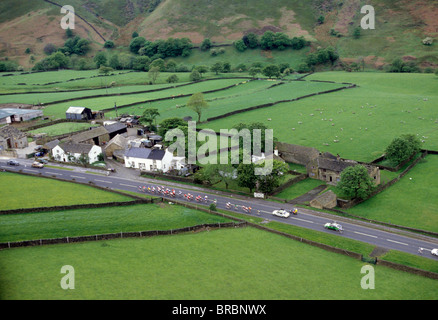 Cycling peleton races along country road Stock Photo