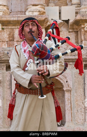 Bedouin playing the bagpipes in the old amphitheatre of Jerash, Jordan Stock Photo