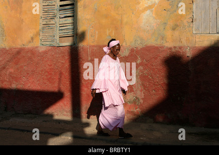 Woman walking in street, St. Louis, Senegal, West Africa Stock Photo