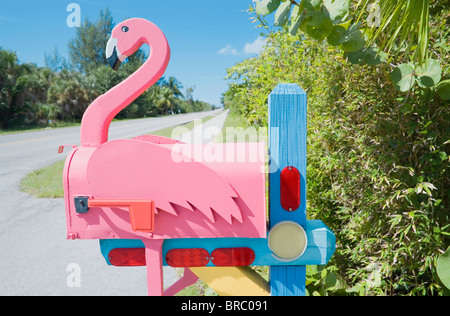Flamingo made of wood attached to pink mailbox, Sanibel Island, Florida, USA Stock Photo