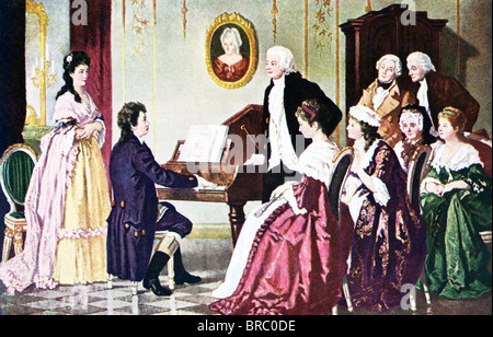 Beethoven plays for Mozart (standing next to pianoforte [early piano]) and several men and women in a salon in Vienna, Austria. Stock Photo