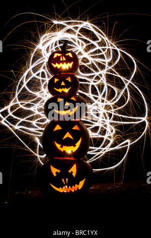 Halloween pumpkins, Jack o lanterns, faces and fireworks Stock Photo