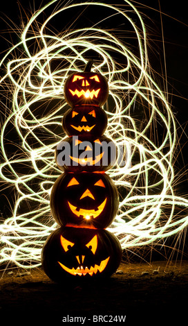 Halloween pumpkins, Jack o lanterns, faces and fireworks Stock Photo