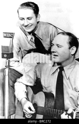 DELMORE BROTHERS  US Country music duo about  1935 with Rabon at left and Alton on an Indiana radio station Stock Photo