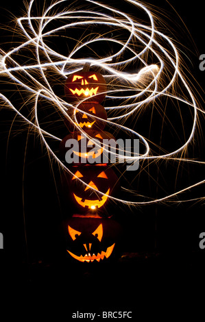 Halloween pumpkins, Jack o lanterns, faces and fireworks Stock Photo