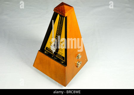 An old fashion wooden metronome. Stock Photo