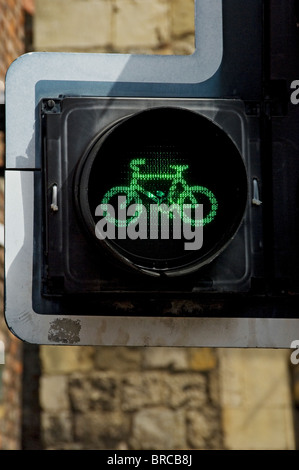 Close up of traffic light lights at green for go bike bike cycling cyclists England UK United Kingdom GB Great Britain Stock Photo