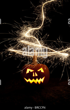 Halloween pumpkin, Jack o lantern, fire face and fireworks Stock Photo