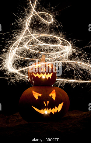 Halloween pumpkin, Jack o lantern, fire face and fireworks Stock Photo