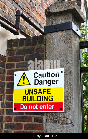 Warning sign for unsafe building Stock Photo