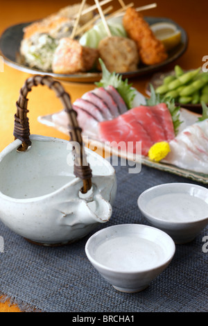 Sake and dishes Stock Photo