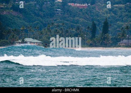 Laird Hamilton foil surfing in Hanalei Bay, Kauai, Hawaii Stock Photo