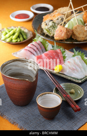 Sake and dishes Stock Photo