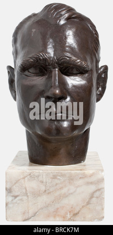 Josef Thorak (1889 - 1952), a life size bronze bust of Rudolf Heß Bronze with beautiful dark brown patina. Signed in the nape 'Thorak', with foundry mark 'Guss Brandstetter München'. Height 36 cm. On a light marble base, total height 47.5 cm. Created between 1935 and 1940. Josef Thorak was next to Arno Breker the most important sculptor of the Third Reich. Before the war, Hitler had built for him a vast studio in Baldham near Munich according to design specifications by Albert Speer. It was at that time the largest art studio in Europe - spacious enough for Tho, Stock Photo