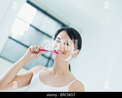 woman using toothbrush Stock Photo