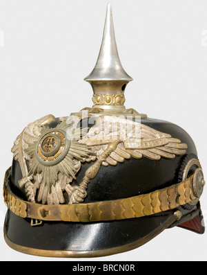 A helmet for Prussian officers, of the Guard Infantry or Pioneers Fibre body with silver-coloured fittings. Guard eagle with the partially enamelled Star of the Order of the Black Eagle. Chinscales and star screws of tombac, officer's cockades. Spike not silvered (renewed?), silk liner renewed, silver-plating rubbed. As worn by the Guard Fusilier Regiment, the 5th Foot Guard Regiment, the Guard Pioneer Battalion and Railroad Regiments 1 - 3. historic, historical, 19th century, Prussian, Prussia, German, Germany, militaria, military, object, objects, stills, cli, Stock Photo