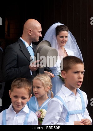 Bride and groom with page boys and girl after marriage service - France. Stock Photo