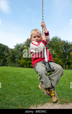 A child blond boy 4 years on a summer playground Stock Photo