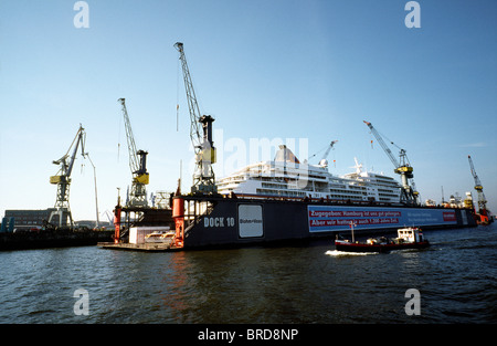 Dock 10 of Blohm+Voss ship yard in the port of Hamburg. Hapag-Lloyd owned cruise liner MS Europa is docked for maintenance. Stock Photo