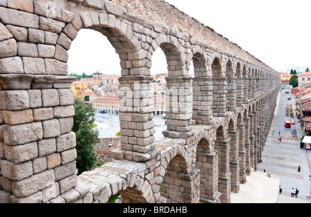 View along the arches of the Roman Aqueduct bridge, built in the 1st century AD, of Segovia Spain. Stock Photo
