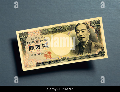 Japanese 10,000 yen banknotes overlapping each other in a long line on ...