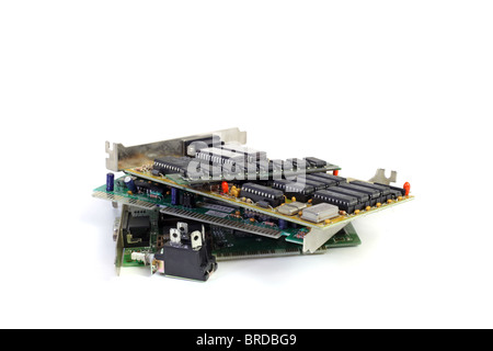 Several electronic boards lying one upon another. All isolated on white background. Stock Photo