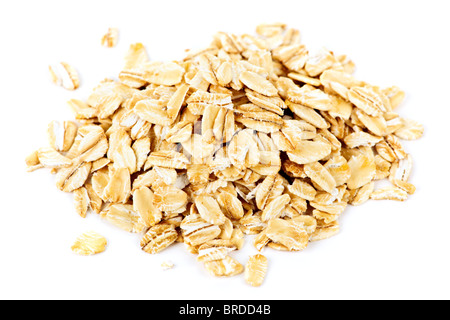 Heap of dry rolled oats isolated on white background Stock Photo