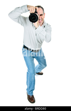 Portrait of male photographer with camera isolated on white background Stock Photo